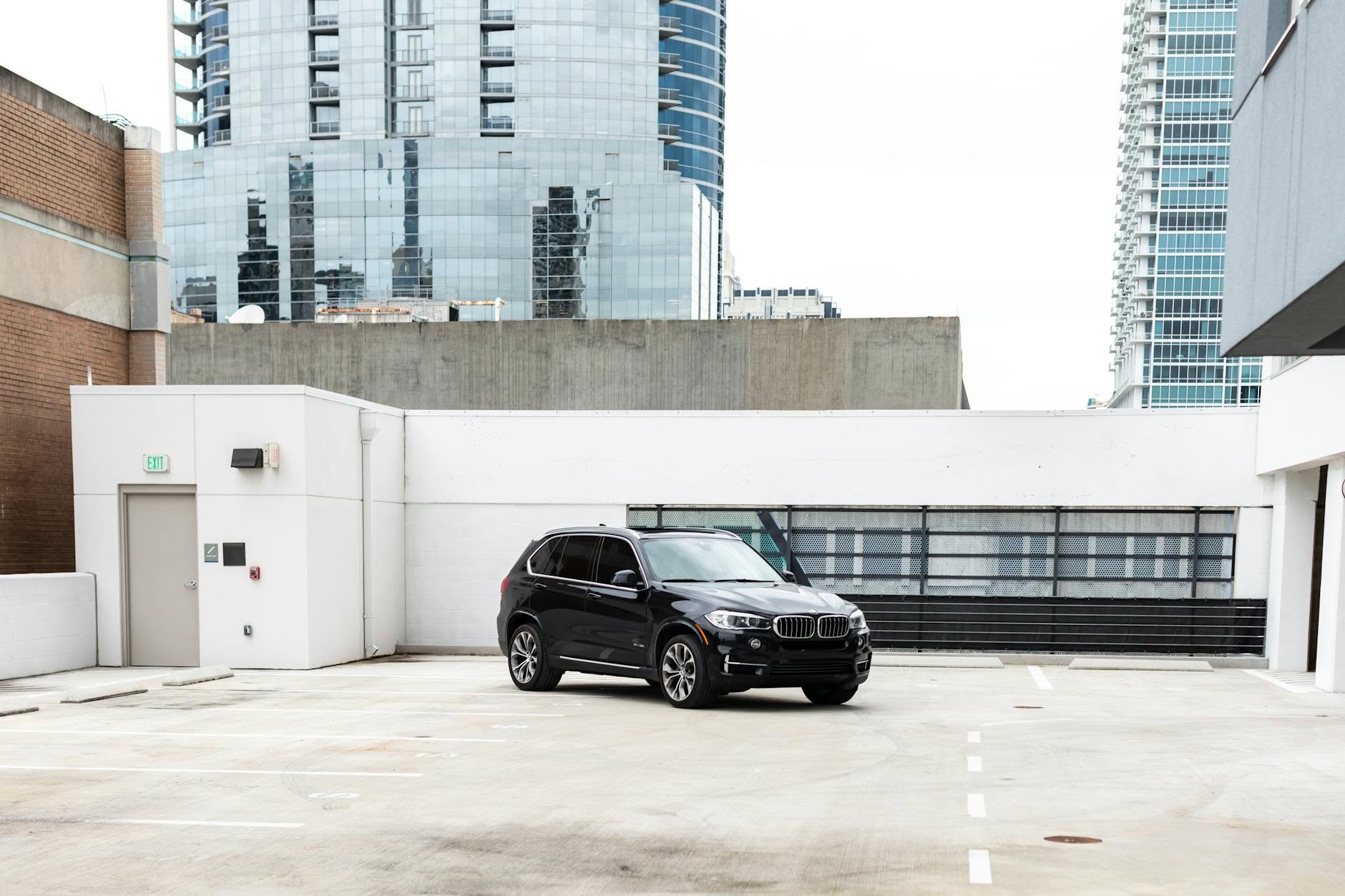 Black Chevrolet Tahoe luxury SUV on urban rooftop, Volantis Limousine Services fleet Chicago